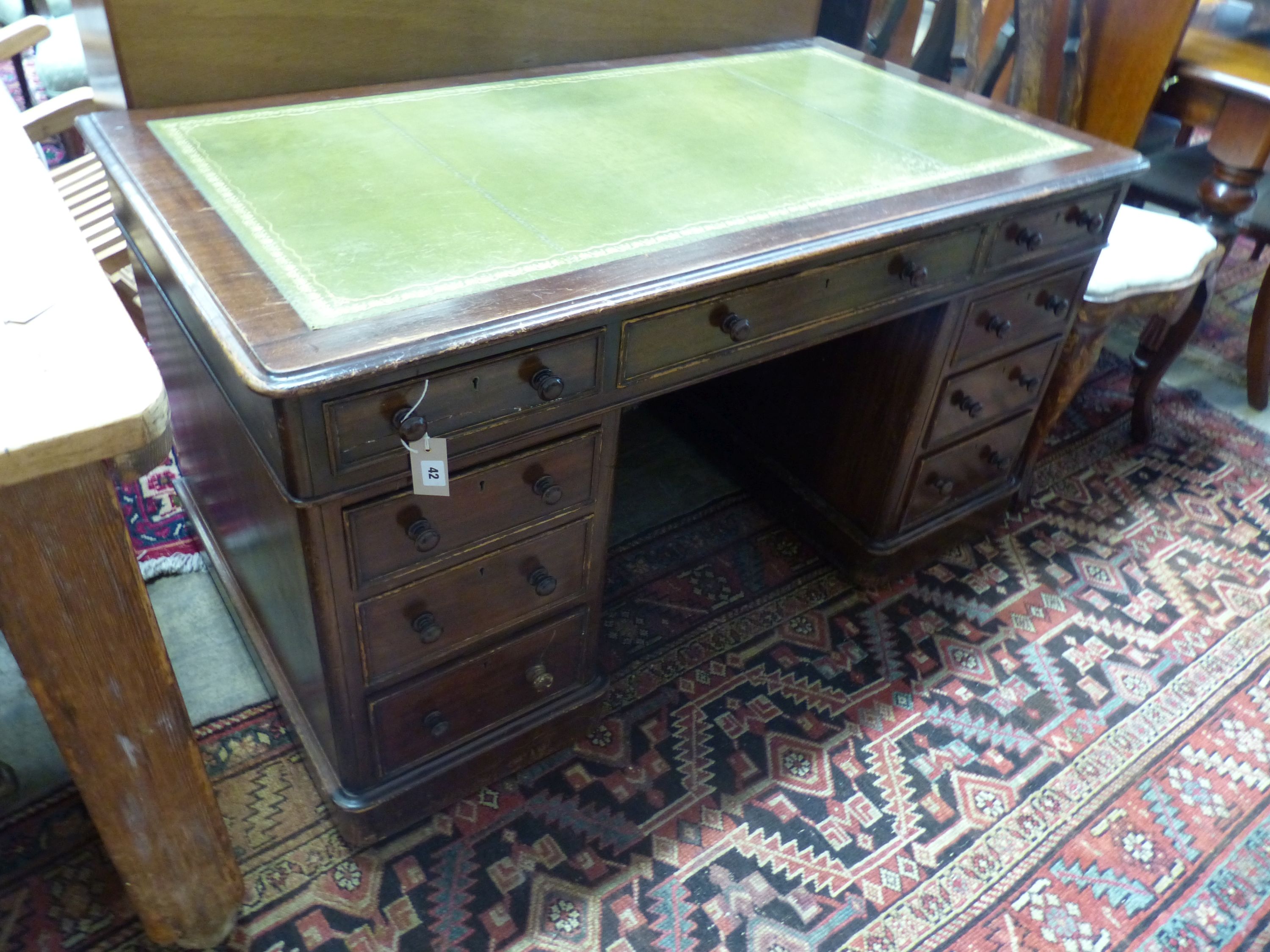A Victorian mahogany/stained beech pedestal desk, length 138cm, depth 75cm, height 74cm